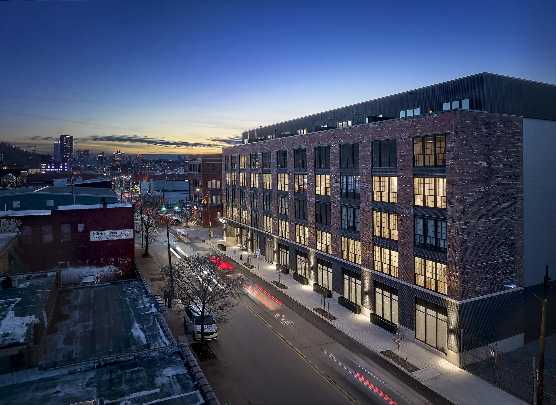 night exterior of mulberry lofts apartment building in pittsburgh